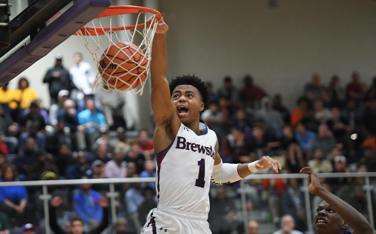 Jalen Lecque (1) of Brewster Academy dunks for two points during the first quarter. The Word of God Holy Rams played the Brewster Academy Bobcats in a high school basketball game that was part of the John Wall Holiday Invitational Tournament in Raleigh, N.C. on December 27, 2018.