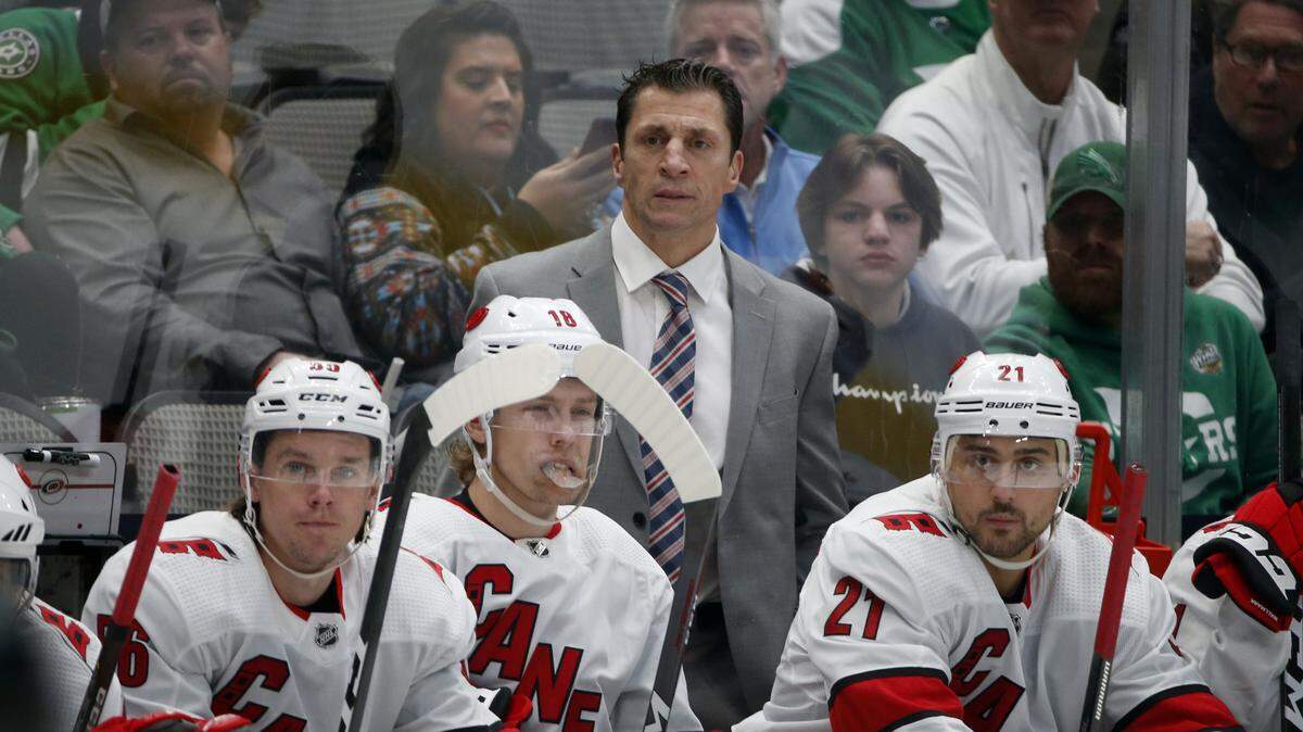 Carolina Hurricanes head coach Rod Brind’Amour watches his team play the Dallas Stars with left wing Erik Haula (56) center Ryan Dzingel (18) and right wing Nino Niederreiter (21) during the first period of an NHL hockey game in Dallas, Tuesday, Feb. 11, 2020. (AP Photo/Michael Ainsworth)