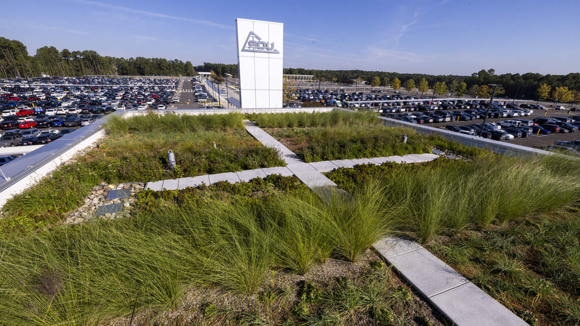 New RDU parking lot building has creature comforts inside and a garden on top