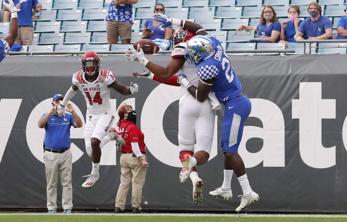 N.C. State wide receiver C.J. Riley (19) makes a nine-yard touchdown reception as Kentucky defensive back Yusuf Corker (29) covers him during the second half of Kentucky’s 23-21 victory over N.C. State in the Gator Bowl at TIAA Bank Field in Jacksonville, Fla., Saturday, January 2, 2021.