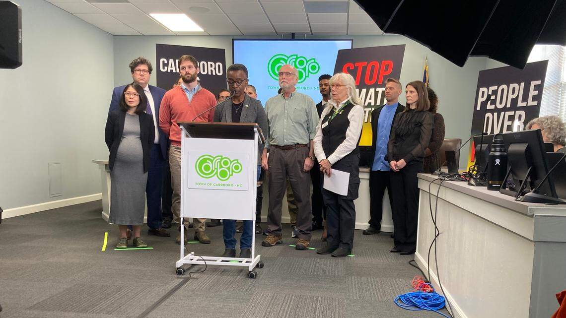 Carrboro Mayor Barbara Foushee is joined by other members of the town’s council and representatives from NC WARN and the Center for Biological Diversity on Wednesday as she discusses a lawsuit the town filed against Duke Energy. The suit alleges that Duke engaged in a decades-long deception campaign downplaying the risks of fossil fuels that has caused and will continue to cause increased costs for the town and its residents.