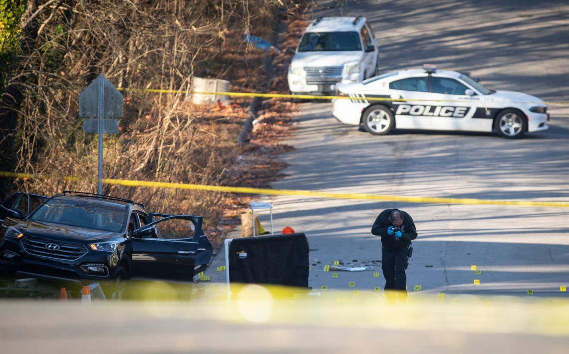 Durham police and forensics units respond on the scene of a deadly shooting in Durham, N.C. where six young people were shot, two fatally, early on Monday morning, Dec. 13, 2021.