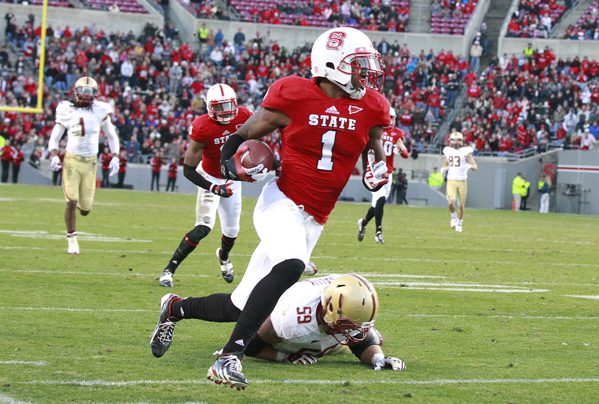 N.C. State cornerback David Amerson (1) beats Boston College center Andy Gallik (59) as he takes an interception in for a touchdown during the first half Saturday, November 24, 2012, at Carter-Finley Stadium in Raleigh, N.C.
