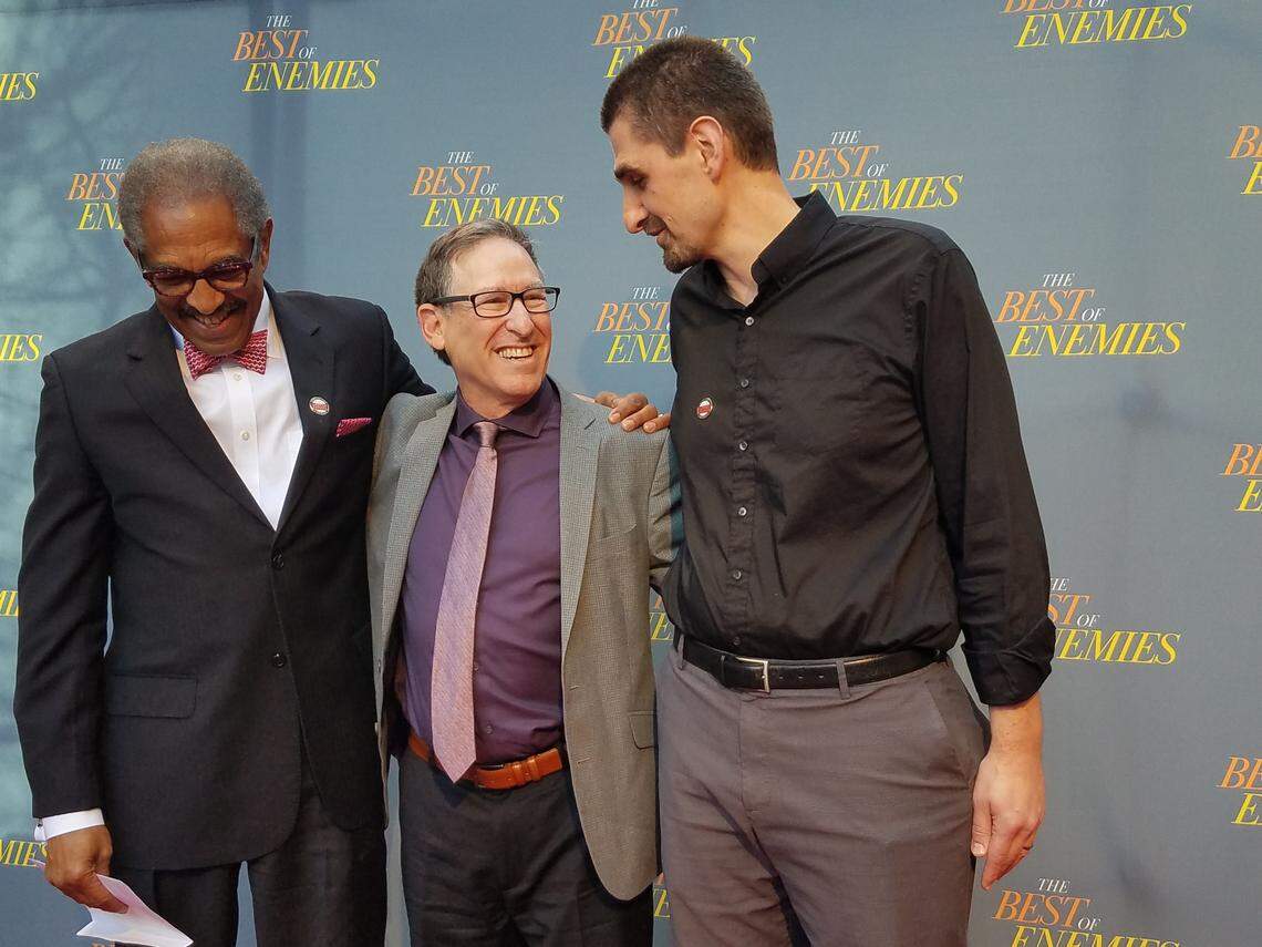 Benjamin Reese Jr., left, and Jonathan Wilson-Hartgrove, right, appear on the red carpet with author Osha Gray Davidson at the March 19, 2019, premiere of “The Best of Enemies” at the Carolina Theatre in Durham, N.C. Davidson’s book was source material for the film, starring Taraji P. Henson and Sam Rockwell. Reese and Wilson-Hartgrove helped bring the film premiere to Durham.