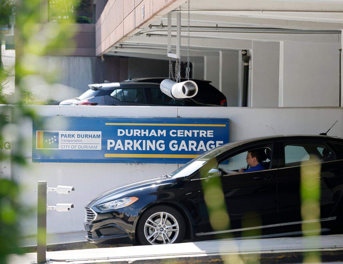 A vehicle exits the Durham Centre Parking Garage on the afternoon of Tuesday, August 2, 2022, in Durham, N.C. 