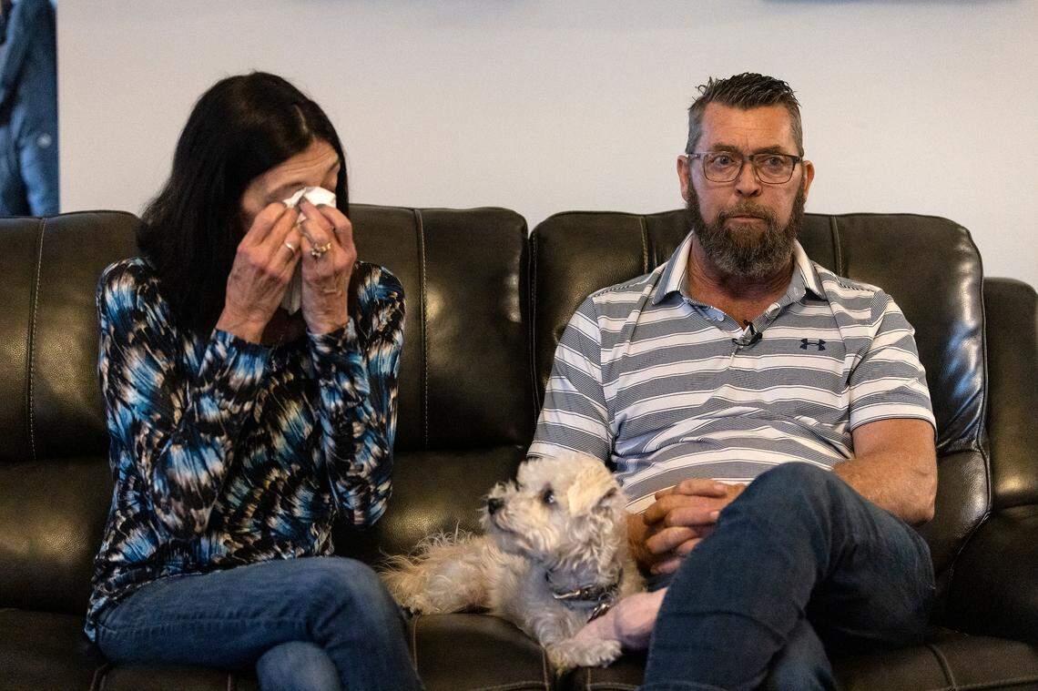 Laura Baker is overcome with emotion as she sits with her husband, Jim, while talking about their daughter. Veronica died after being shot in her car in Raleigh in August 2020.