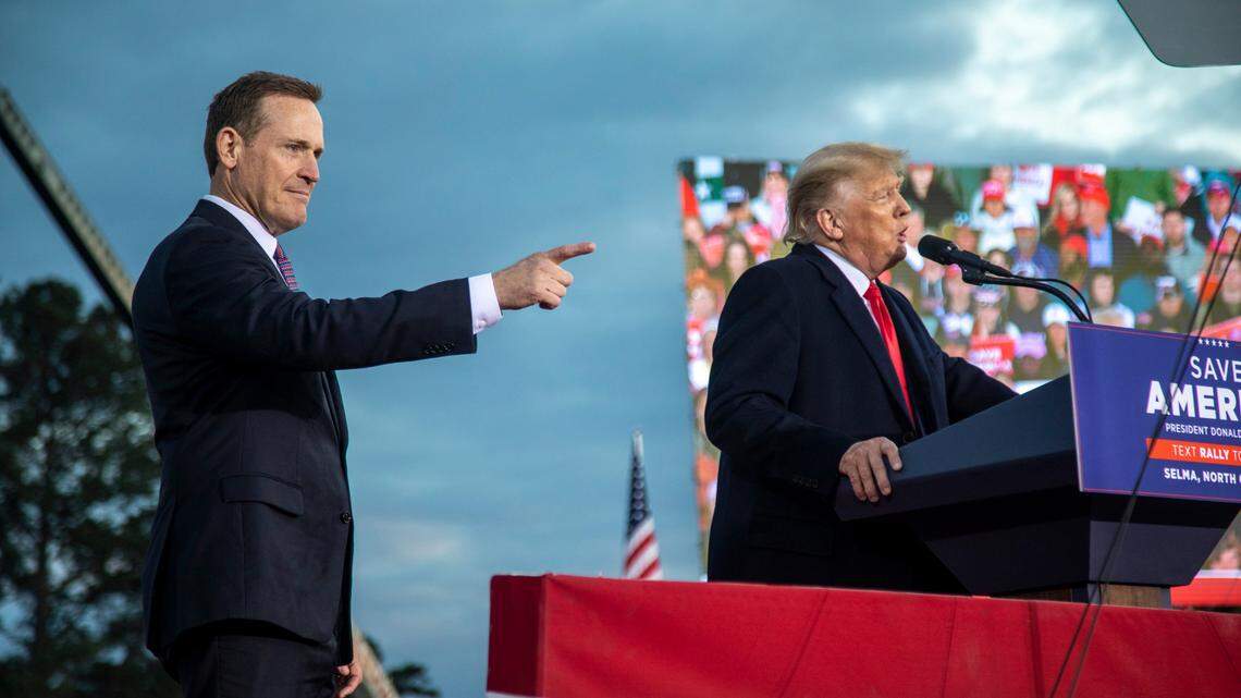 U.S. Senate candidate Ted Budd and former President Donald Trump share the stage during a rally in Selma on Saturday, April 9, 2022.