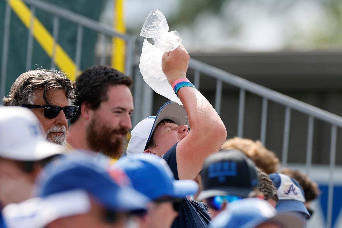 A fan tries to cool down during Duke’s 7-4 victory over Murray St. in the first game of Durham Super Regional at Jack Coombs Field in Durham, N.C., Sat. June 7, 2025.