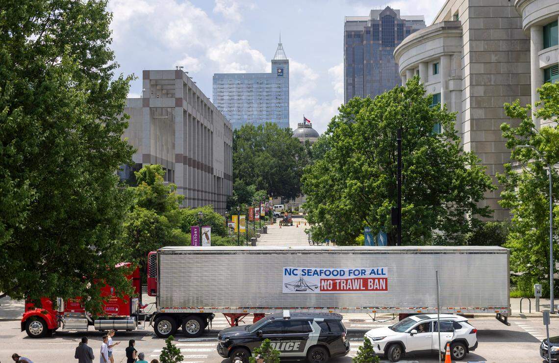 A group of truckers, supporting the North Carolina shrimping industry circle the North Carolina General Assembly on Jones Street in an effort for to stop HB 442, legislation that would prohibit shrimp trawling in all inshore fishing waters and within one-half mile of the shoreline, on Tuesday, June 24, 2025 in Raleigh, N.C.