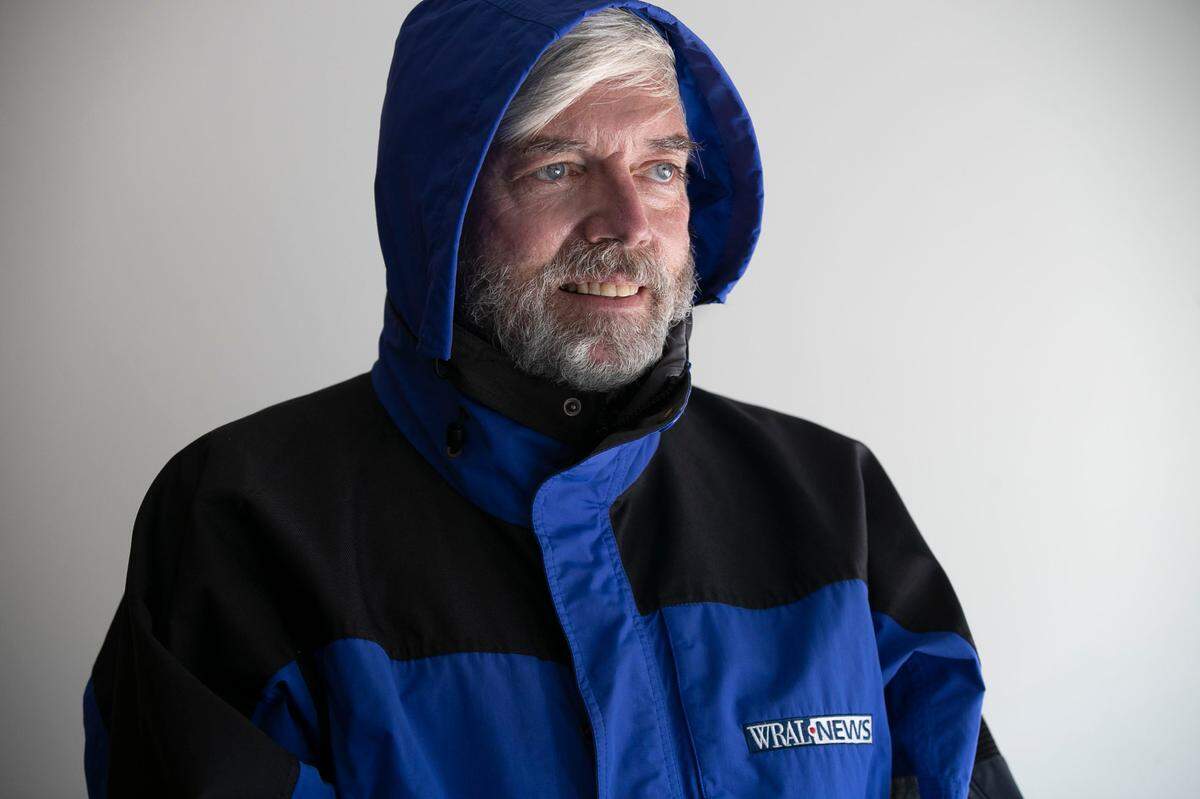 Greg Fishel has always had a fondness for winter weather. He poses for a portrait in his WRAL winter parka at his home on Tuesday, July 15, 2020 in Raleigh, N.C.