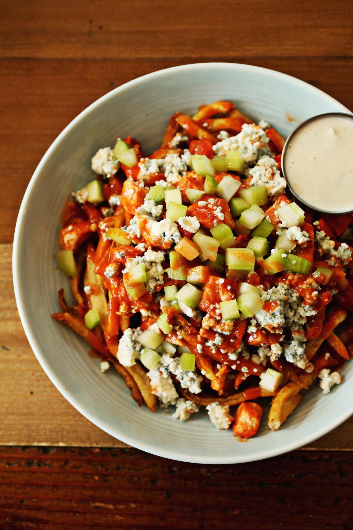 Canadian purists will chuckle at the substitution of cheddar for the traditional cheese curds in the Montreal poutine, but the Buffalo poutine is worth a detour at Breakaway Cafe in Chapel Hill.