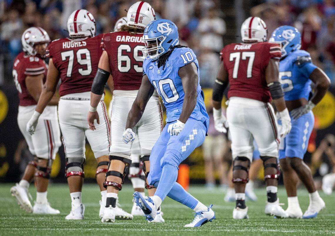 North Carolina’s Desmond Evans (10) reacts after a sack of South Carolina quarterback Spencer Rattler (7) for a nine-yard loss in the third quarter on Saturday September 2, 2023 at Bank of America Stadium in Charlotte, N.C.