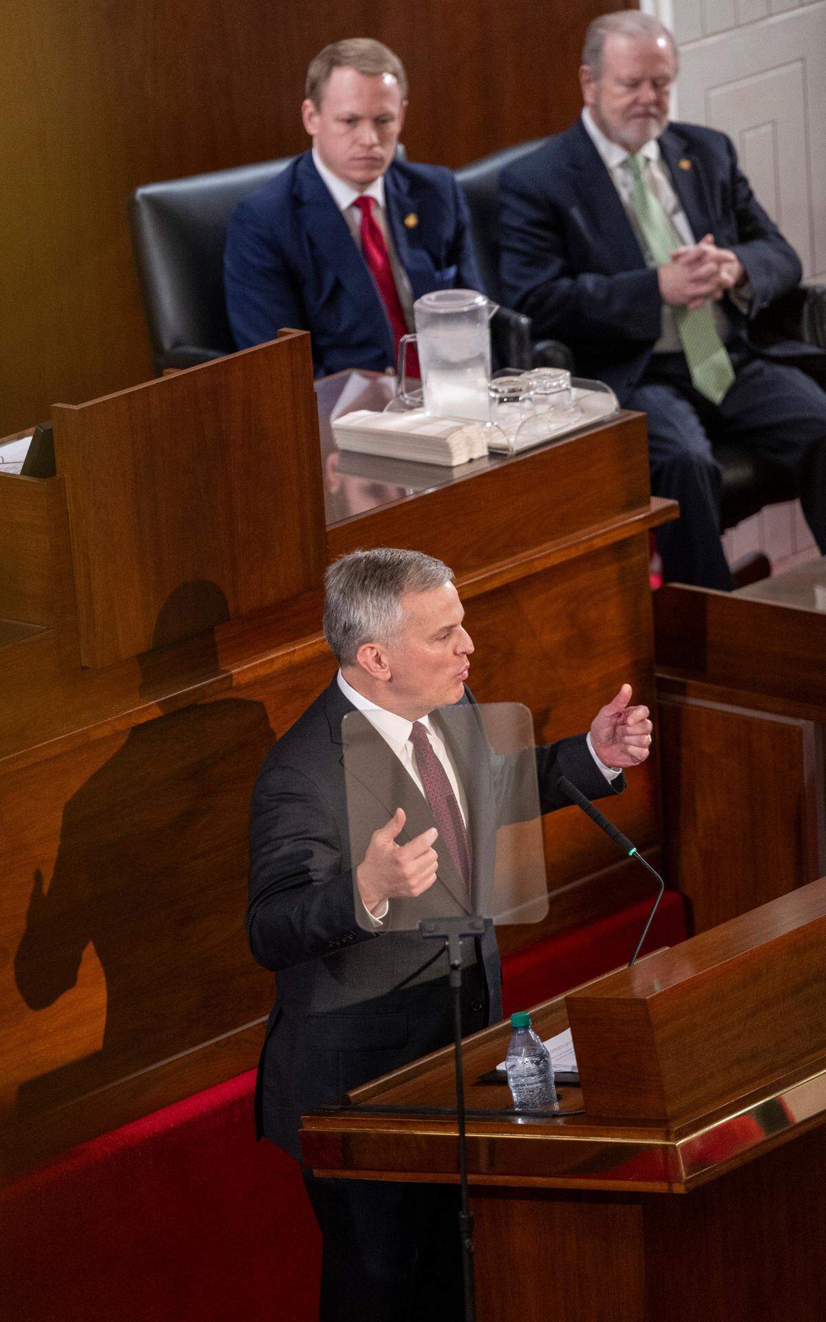 Gov. Josh Stein delivers his State of the State address as House Speaker Destin Hall and Senate leader Phil Berger look on during a joint session of the General Assembly on Wednesday, March 12, 2025, in the House chamber of the Legislative Building.