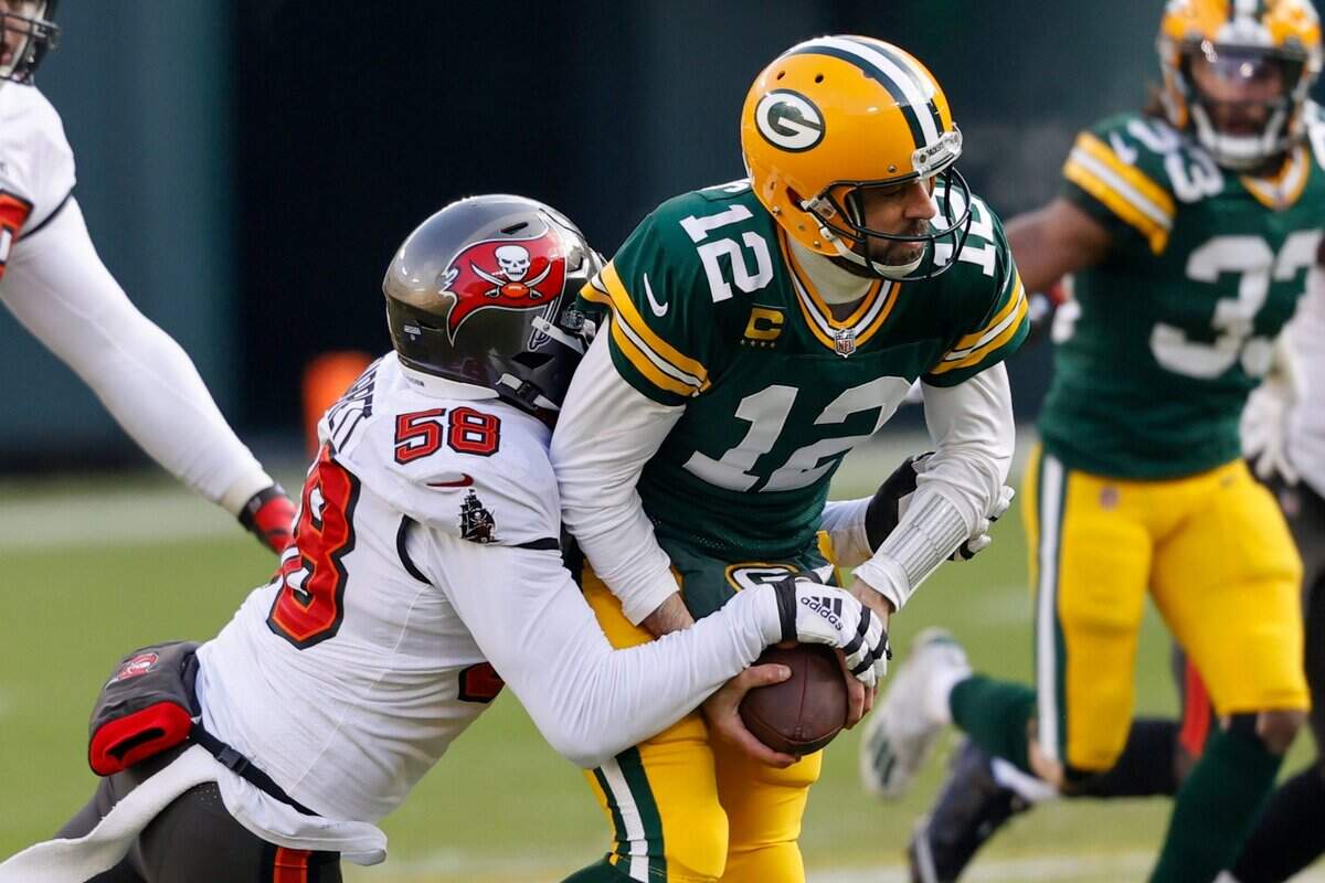 Tampa Bay Buccaneers’ Shaquil Barrett (58) sacks Green Bay Packers quarterback Aaron Rodgers (12) during the first half of the NFC championship NFL football game in Green Bay, Wis., Sunday, Jan. 24, 2021.