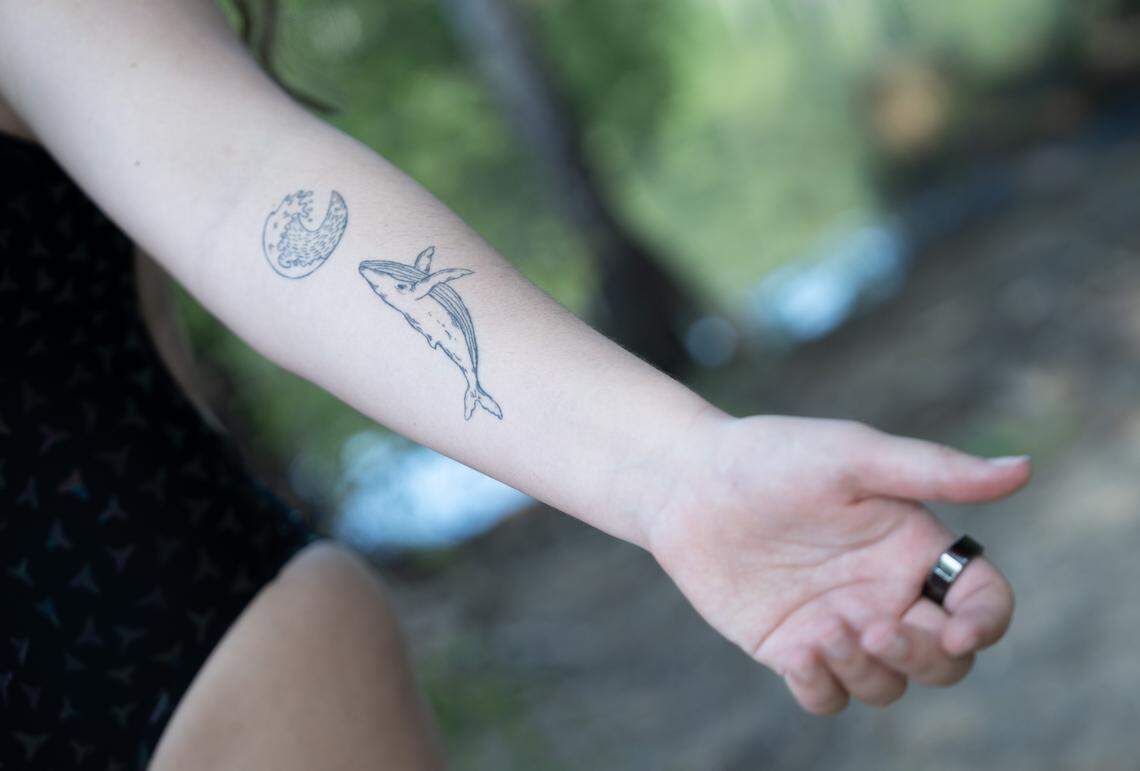 Lorelei Schmidt got these tattoos after an open water swim in Hawaii, where she swam with whales.