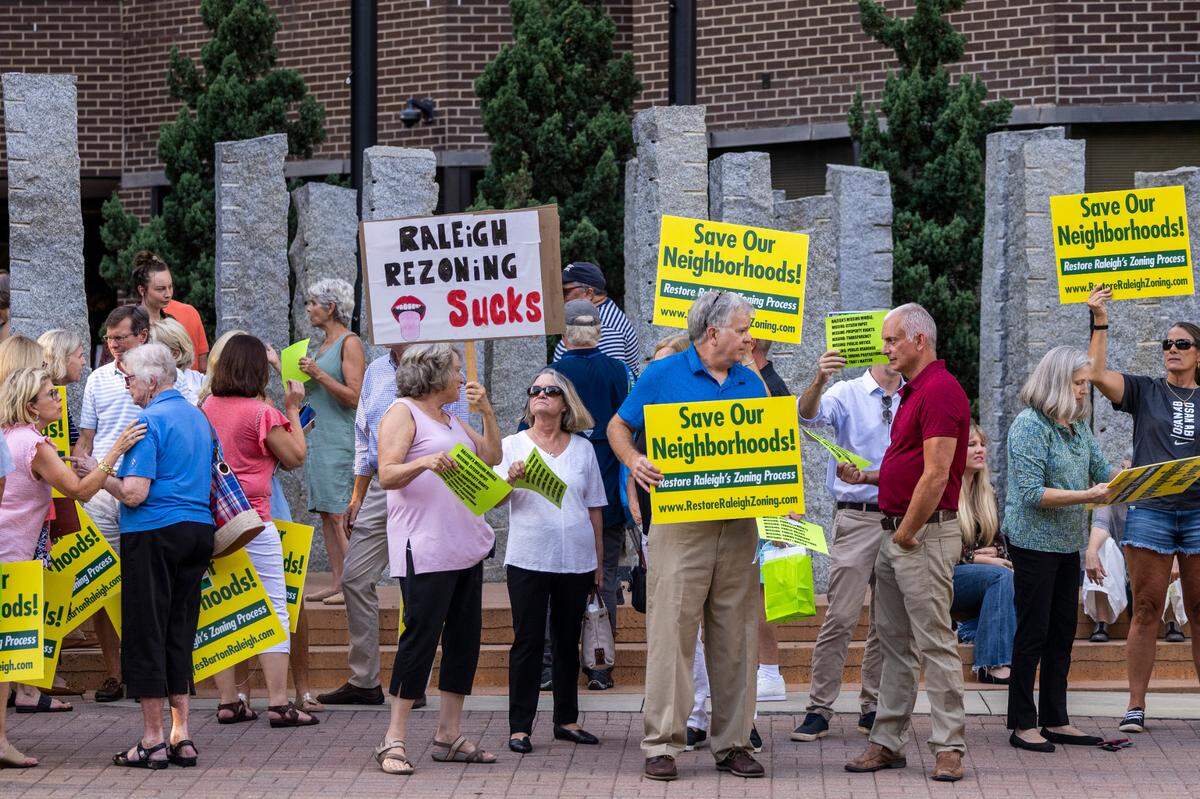Demonstrators protest outside the Raleigh Municipal Building prior to a city council meeting Tuesday Sept. 6, 2022. Many of the demonstrators opposed recent amendments to Raleigh’s zoning ordinances.