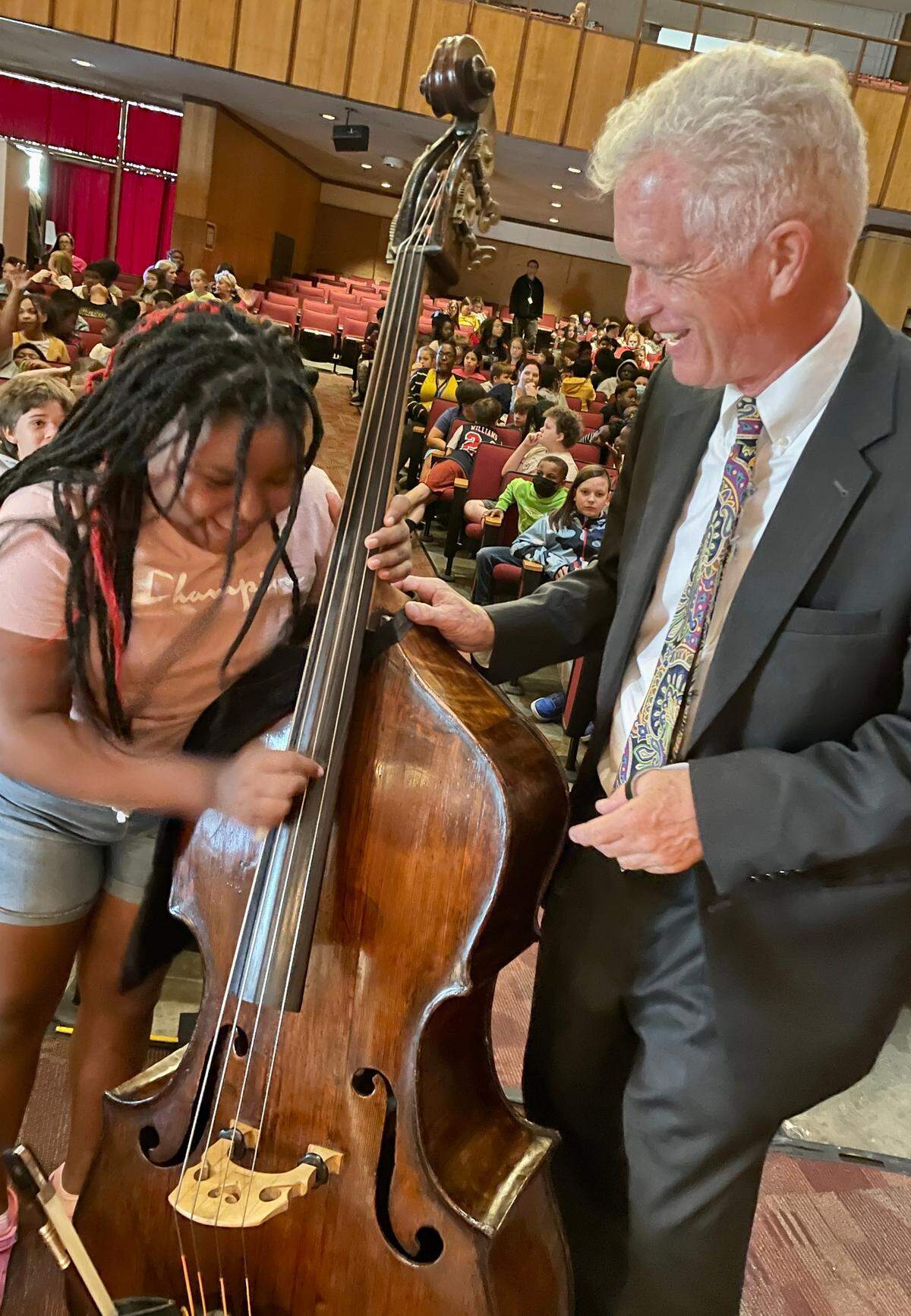 Erik Dyke encourages a budding musician in Rockingham County as part of the NC Symphony’s outreach.