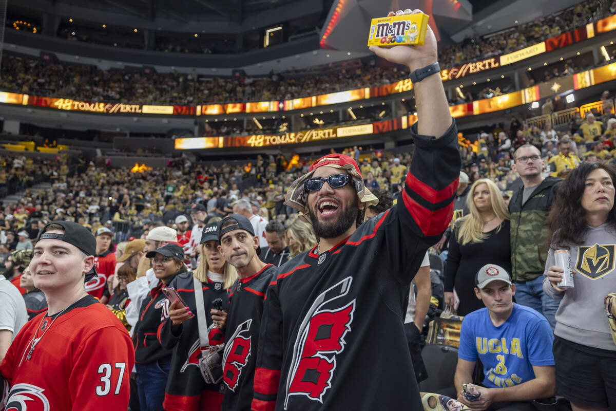 Carolina Hurricanes fan Samu Elisaia, of Salt Lake City, ties to get the attention of his favorite player, during the warm up period, prior to Game 3 of the Stanley Cup Final against Vegas Golden Knights, on Saturday, June 6, 2026 at T-Mobile Arena in Las Vegas, NV.