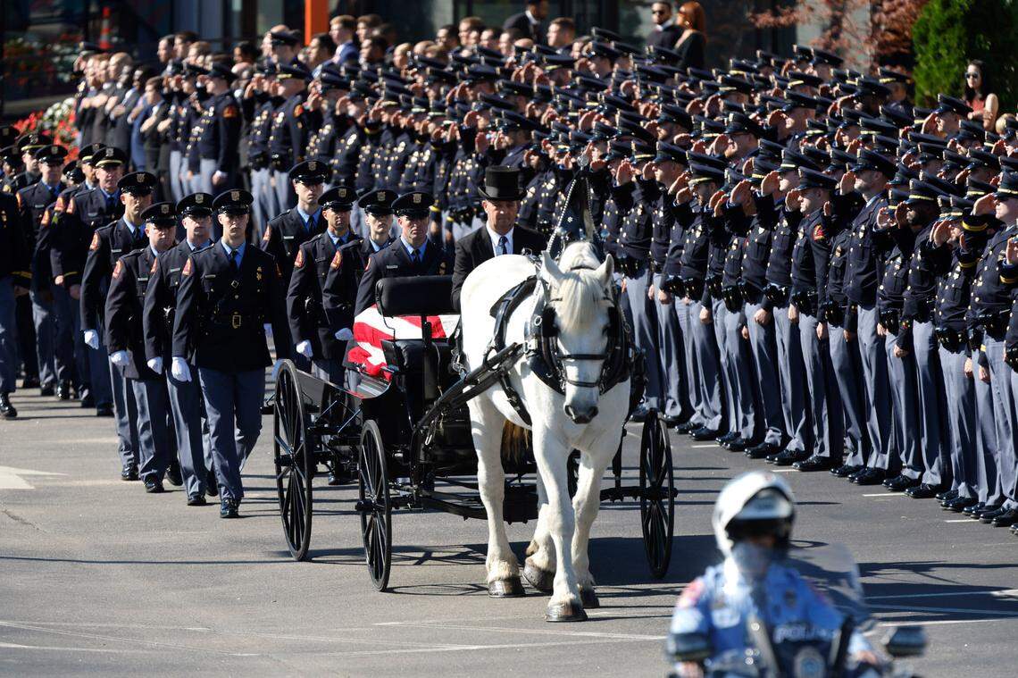 A funeral caisson transports the casket of Raleigh Police Officer Gabriel Torres to Cross Assembly Church in Raleigh, N.C. for his funeral Saturday, Oct. 22, 2022. Officer Torres was killed during a mass shooting Oct. 13.