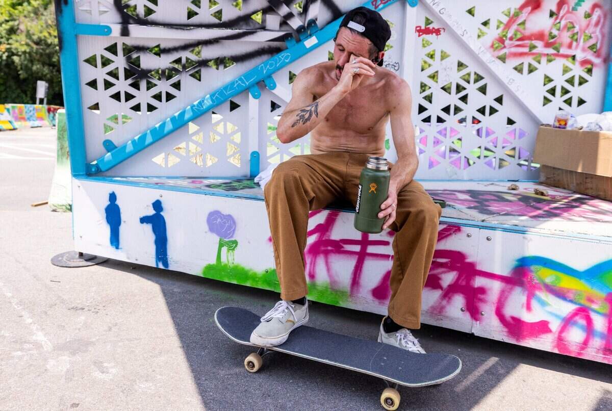 Matt Brokaw, 35, of Raleigh takes a break under a shelter while trying to perfect a skateboard trick at Conlon Family Skatepark near downtown Raleigh as temperatures climbed into the mid-90s on Thursday afternoon, June 26, 2025. “I can only skate a couple minutes and then I gotta stop. I get about five tries and then I about keel over,” Brokaw said between gulps of water. “Makes you want to go home and get an icy pop.”