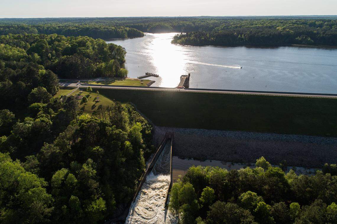 Water flows flows through a dam spillway from Falls Lake into the Neuse River Thursday May 2, 2019 in Raleigh.