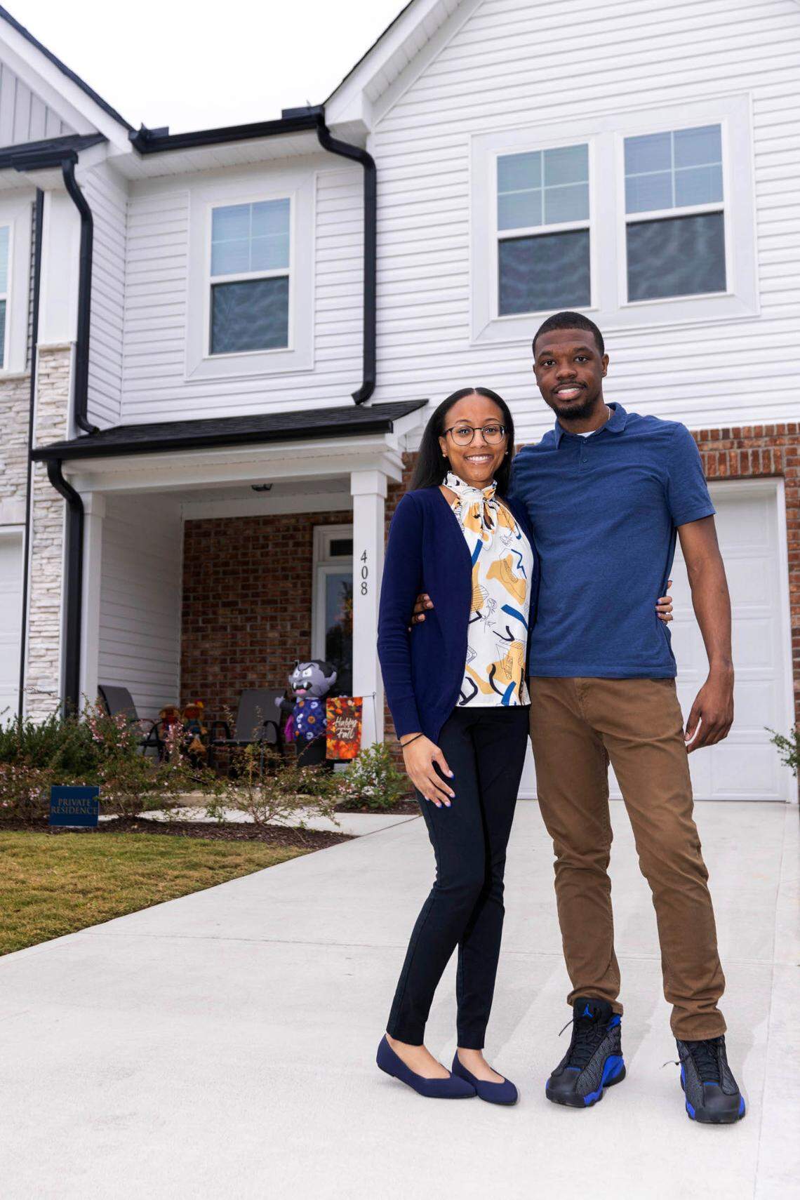 Deondre and Ariel Cason at their new two-story townhouse in the Barrington subdivision, outside Zebulon.
