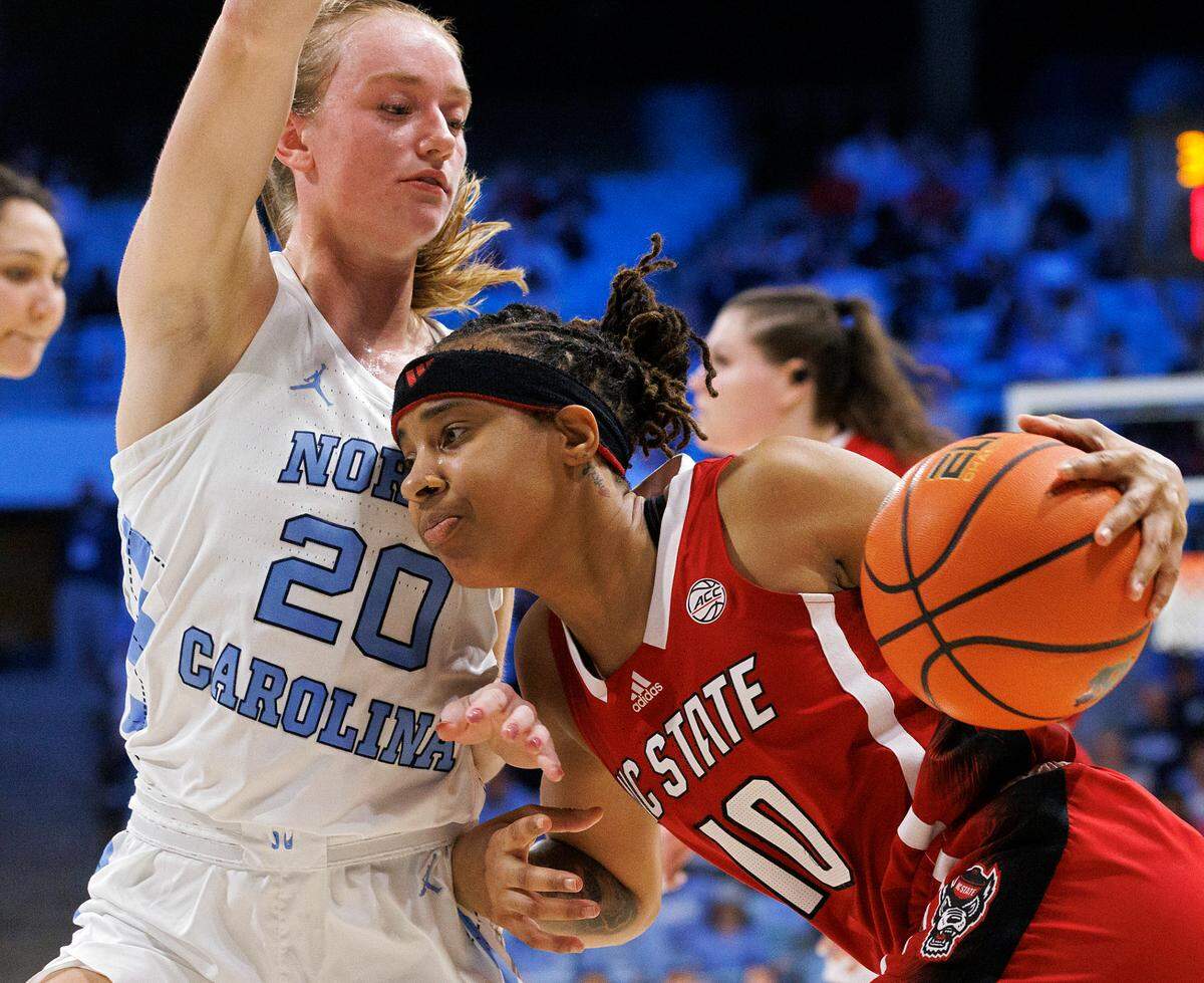 N.C. State’s Aziaha James drives against North Carolina’s Lexi Donarski during the second half of the Wolfpack’s 80-70 loss on Thursday, Feb. 22, 2024, at Carmichael Arena in Chapel Hill, N.C.