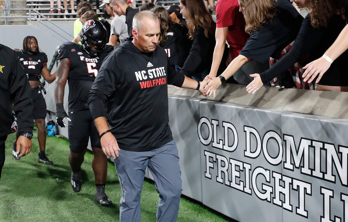 N.C. State head coach Dave Doeren walks off the field after Louisville’s 13-10 victory over N.C. State at Carter-Finley Stadium in Raleigh, N.C., Friday, Sept. 29, 2023.