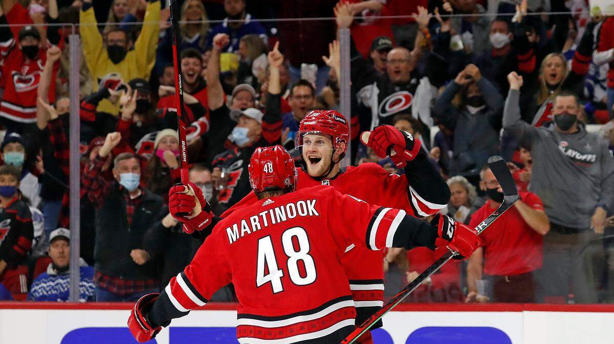 Carolina Hurricanes’ Steven Lorentz (78) celebrates his goal with teammate Jordan Martinook (48) during the second period of an NHL hockey game against the Toronto Maple Leafs in Raleigh, N.C., Monday, Oct. 25, 2021. (AP Photo/Karl B DeBlaker)