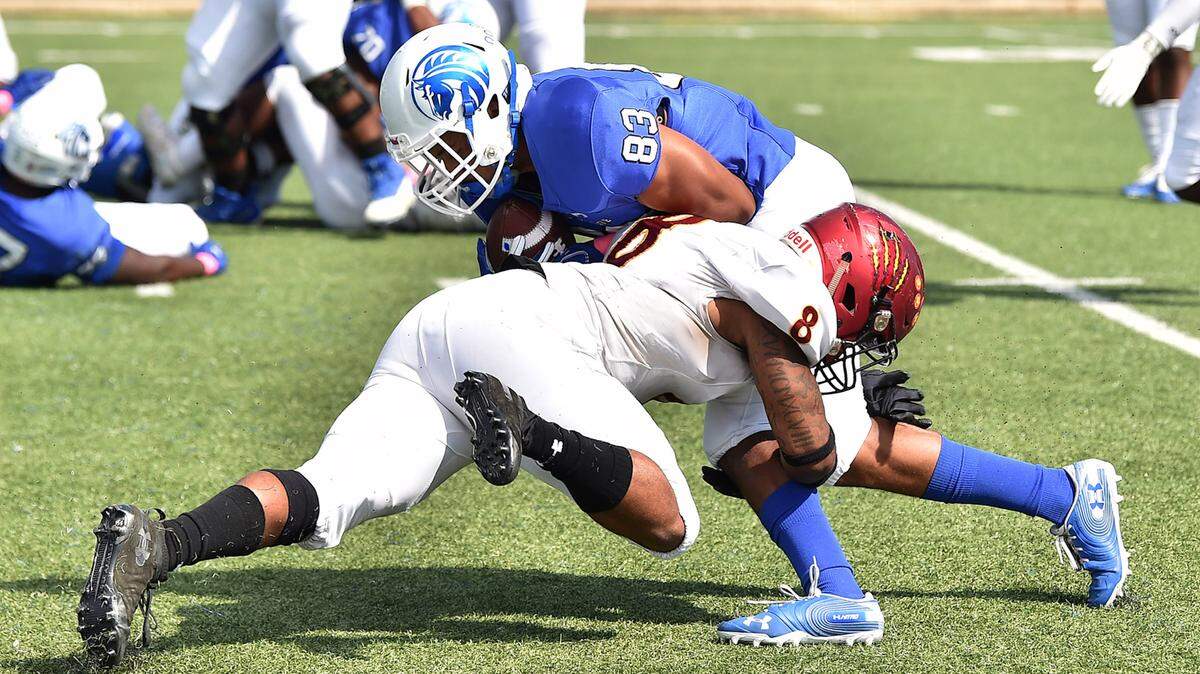 Shaw defensive back Jaleel Scroggins (8) tackles Fayetteville State’s Brandon Person-Boyd (83) in their game in Fayetteville , N.C. on October 12, 2019.