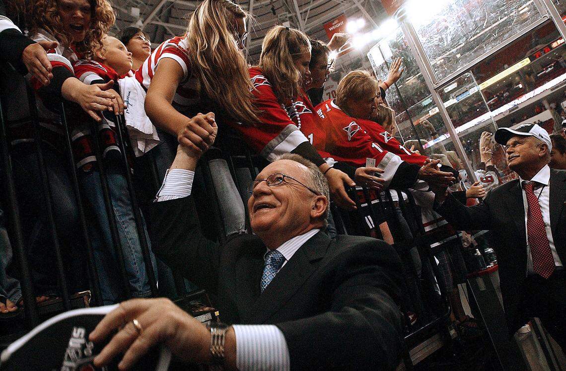 Carolina Hurricanes Jim Rutherford, president and general manager, and Peter Karmanos, owner, are congratulated by fans as they celebrate the Stanley Cup Championship June 19, 2006 after the Canes won Game 7 of the Stanley Cup Final 3-1 against the Edmonton Oilers.