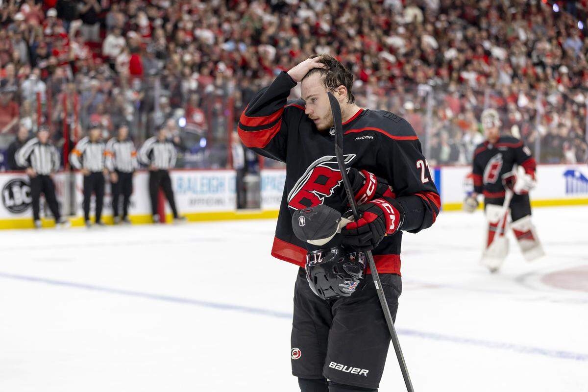 Carolina Hurricanes defenseman Alexander Nikishin (21) leaves the ice with goalie Frederik Andersen (31) following their 6-1 victory over Montreal, clinching the Eastern Conference Finals, on Friday, May 29, 2026 at Lenovo Center in Raleigh, N.C.