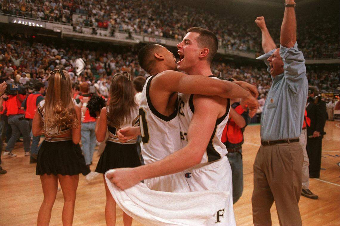 Wake’s Scooter Banks celebrates with Rusty Larue seconds after Wake Forest claimed the ACC crown.