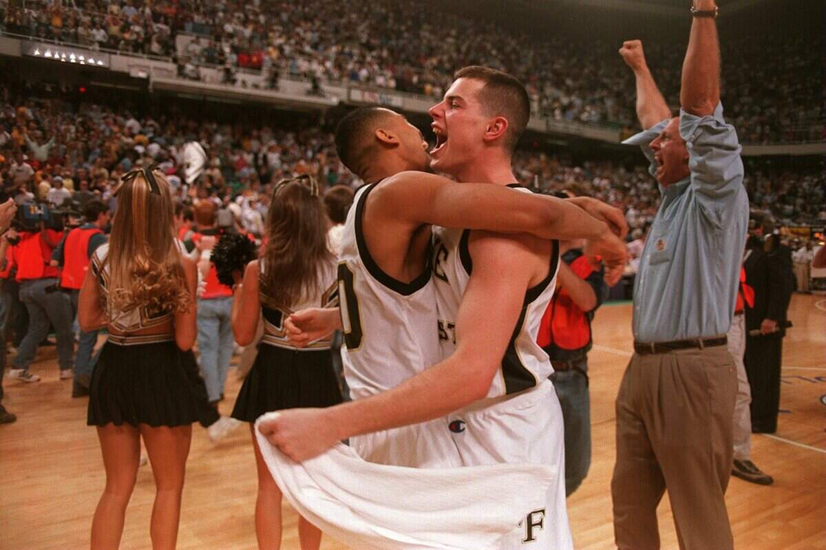 Wake’s Scooter Banks celebrates with Rusty Larue seconds after Wake Forest claimed the ACC crown.