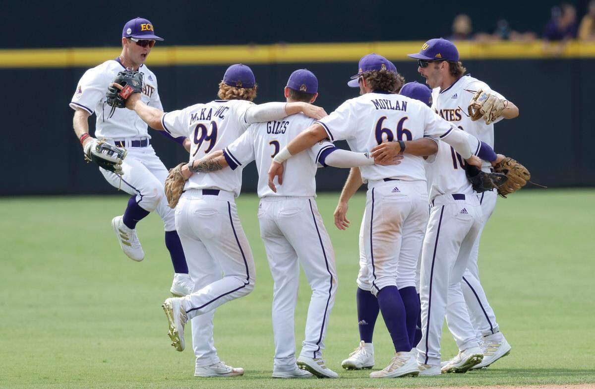 East Carolina players celebrate after ECUs 13-7 victory over Texas in the Greenville Super Regional at Clark-LeClair Stadium Friday, June 10, 2022.