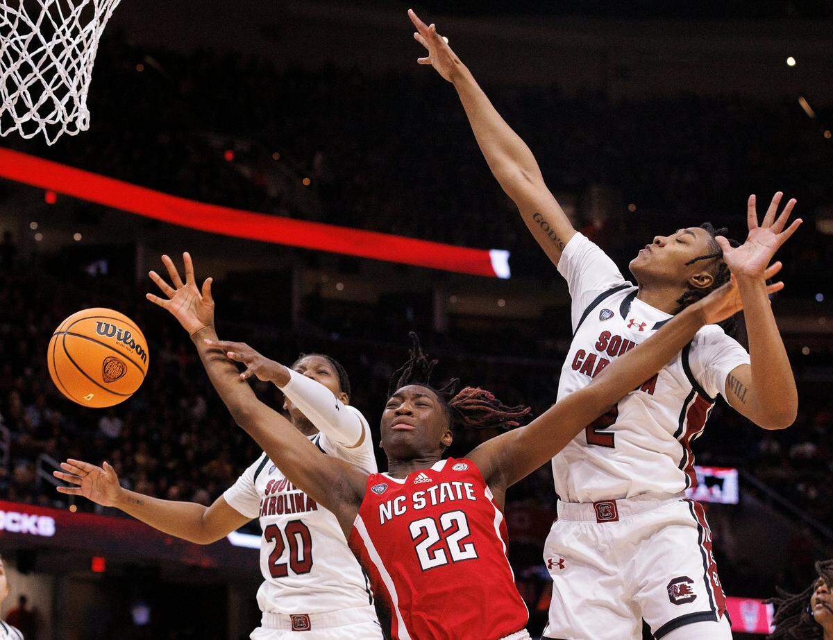 N.C. State’s Saniya Rivers drives between South Carolina’a Sania Feagin and Ashlyn Watkins during the first half of the Wolfpack’s Final Four matchup at Rocket Mortgage FieldHouse on Friday, April 5, 2024, in Cleveland, Ohio.