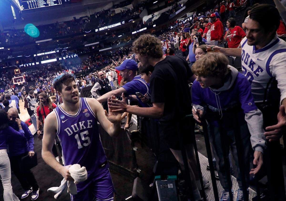 Duke’s Ryan Young is congratulated by fans as he exits the court following the Blue Devils’ 54-51 win over Houston in the NCAA Tournament Sweet 16 on Friday, March 29, 2024, at American Airlines Center in Dallas, Texas.