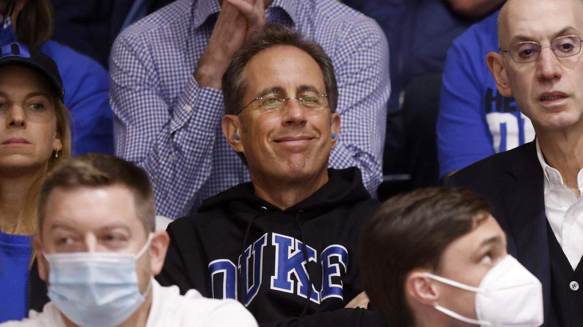 Jerry Seinfeld and Commissioner of the NBA Adam Silver watch during Duke’s game against UNC at Cameron Indoor Stadium in Durham, N.C., Saturday, March 5, 2022.