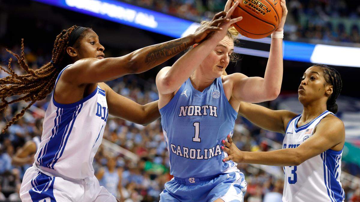 Duke’s Elizabeth Balogun and Ashlon Jackson defend North Carolina’s Alyssa Ustby in a full-court press during the second half of the Blue Devils’ 44-40 win over North Carolina in an ACC Women’s Basketball Tournament quarterfinal game on Friday, March 3, 2023, at Greensboro Coliseum in Greensboro, N.C.