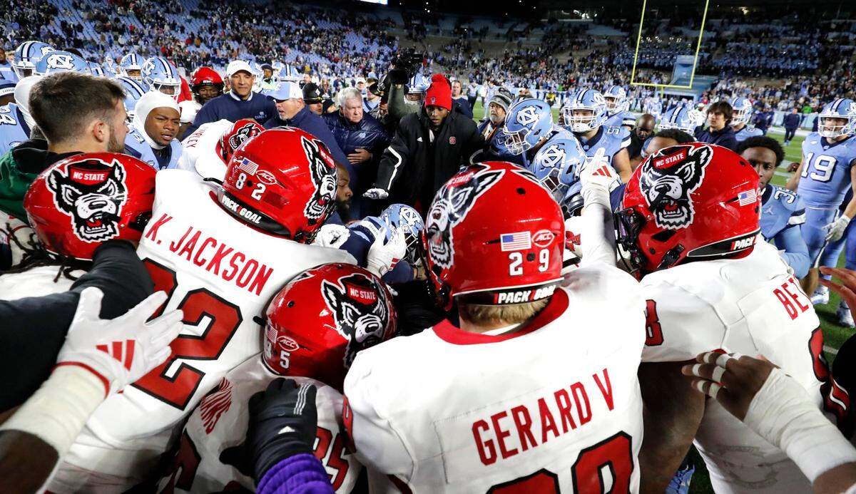 N.C. State and North Carolina players scuffle after N.C. State’s 35-30 victory over UNC at Kenan Stadium in Chapel Hill, N.C., Saturday, Nov. 30, 2024.