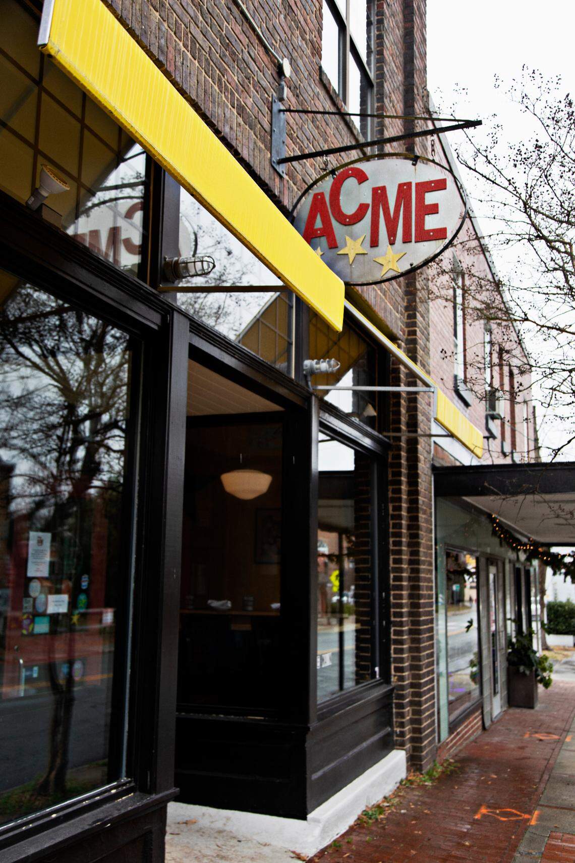 Striking workers allege unfair labor practices at Carrboro restaurant Acme.