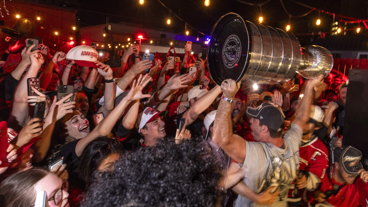 Carolina Hurricanes fans celebrate the team's Stanley Cup Final victory at Teets in Raleigh's Glenwood South district as the Stanley Cup, accompanied by Hurricanes players and staff, makes an appearance during a victory celebration Monday, June 15, 2026. The Hurricanes defeated the Vegas Golden Knights 4-2 in the Stanley Cup Final to win the franchise's second championship since 2006.