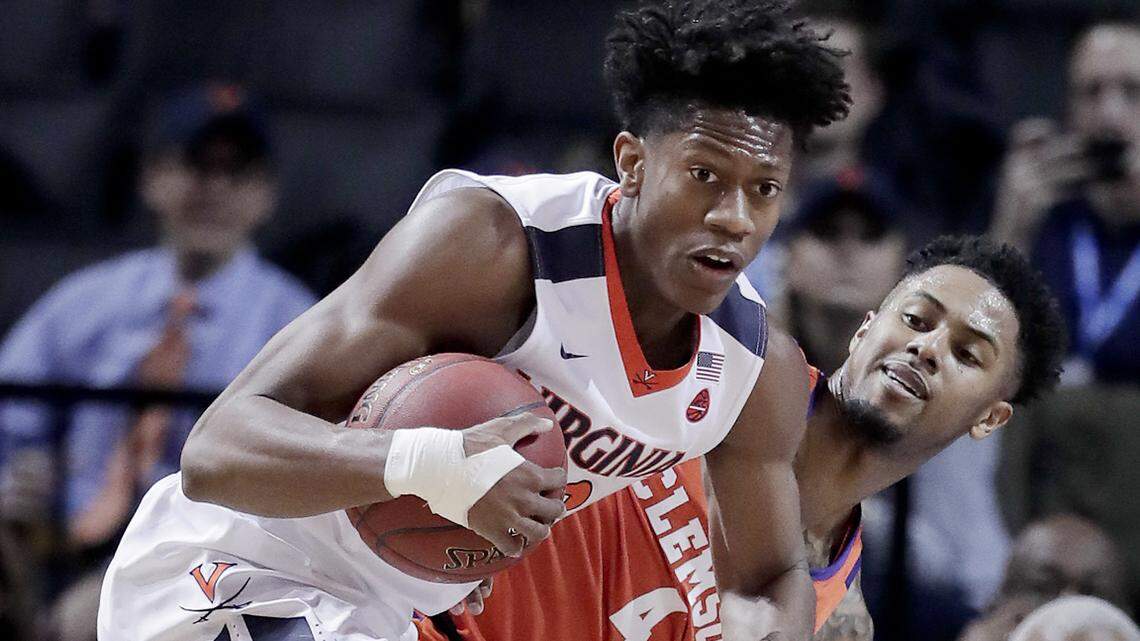 Virginia guard De'Andre Hunter (12) pulls down a rebound next to Clemson guard Shelton Mitchell (4) during the first half.