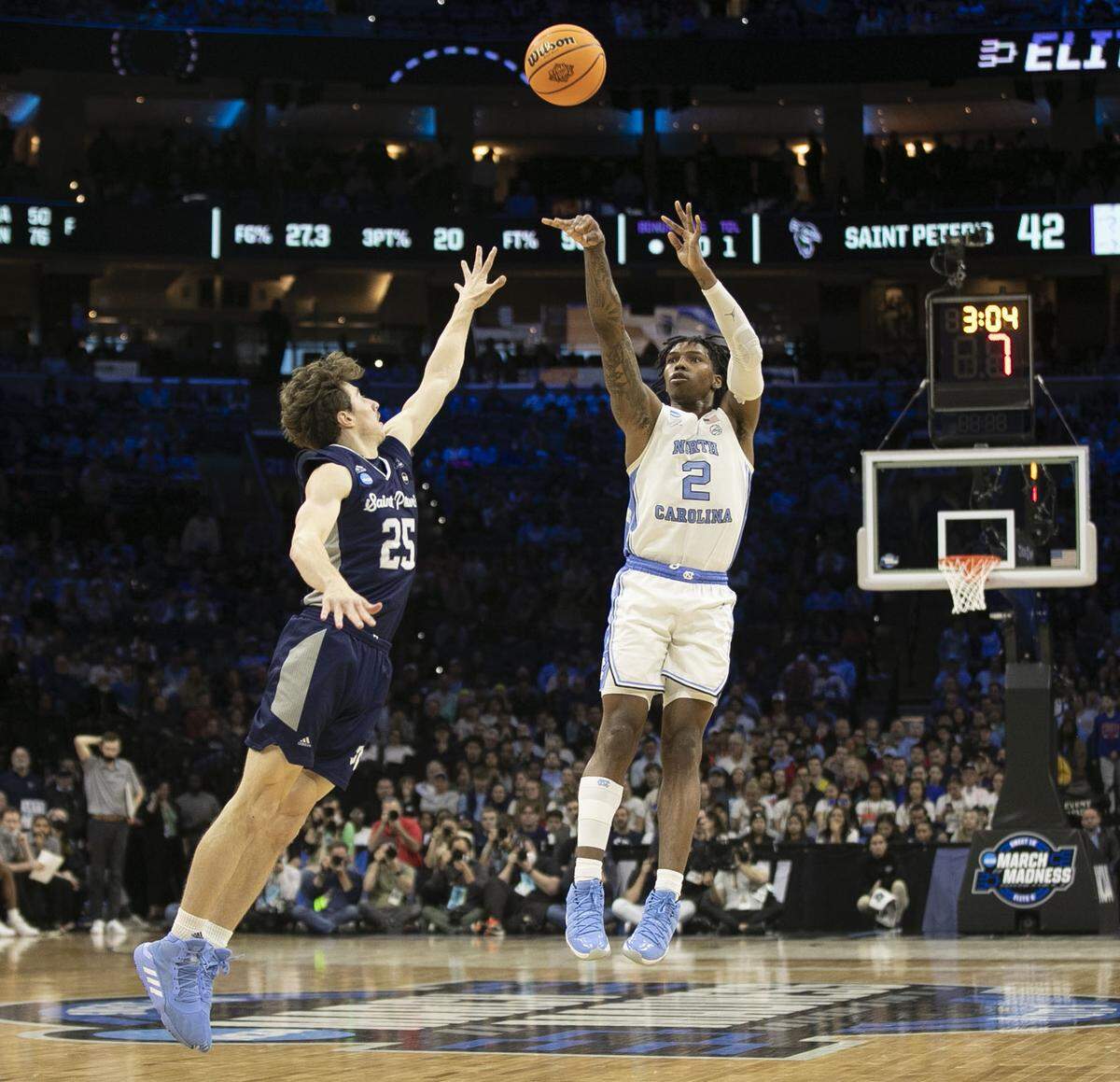 North Carolina’s Caleb Love (2) shoots over Saint Peter’s Doug Edert (25) in the NCAA East Regional final on Sunday, March 27, 2022 at Wells Fargo Center in Philadelphia, Pa.