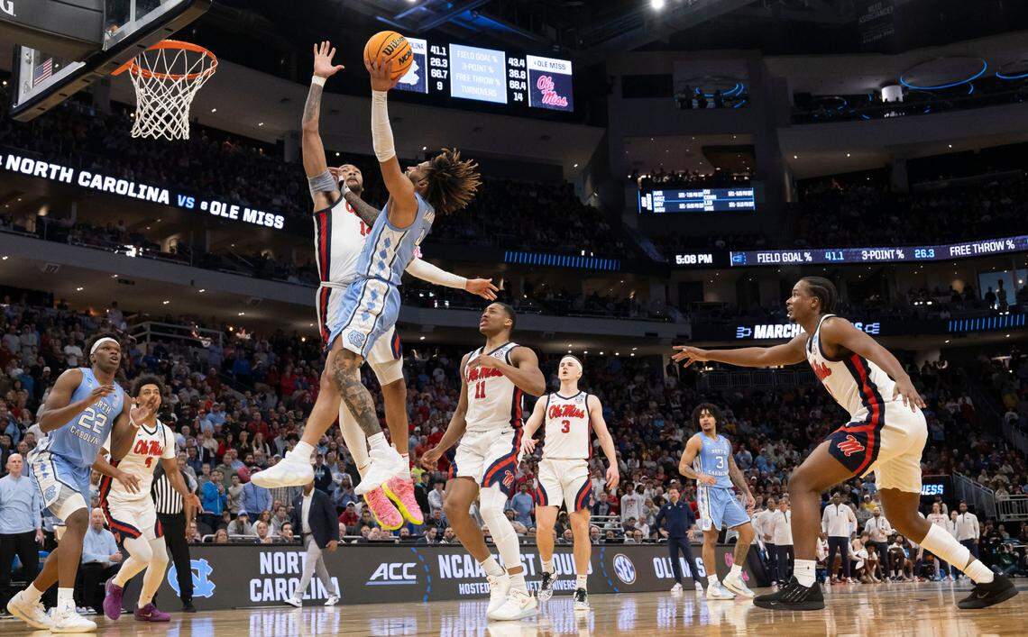 North Carolina guard R.J. Davis (4) drives to the basket against Ole Miss’ Dre Davis (14) scoring his final basket in the Tar Heels’ 71-64 loss in the first round of the NCAA Tournament on Friday, March 21, 2025 at Fiserv Forum in Milwaukee, Wisconsin.