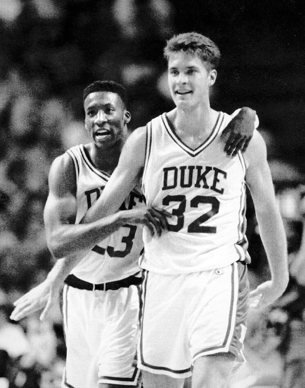 Duke’s Brian Davis, left, embraces teammate Christian Laettner as the Blue Devils defeat Georgia Tech in the 1992 ACC tournament.