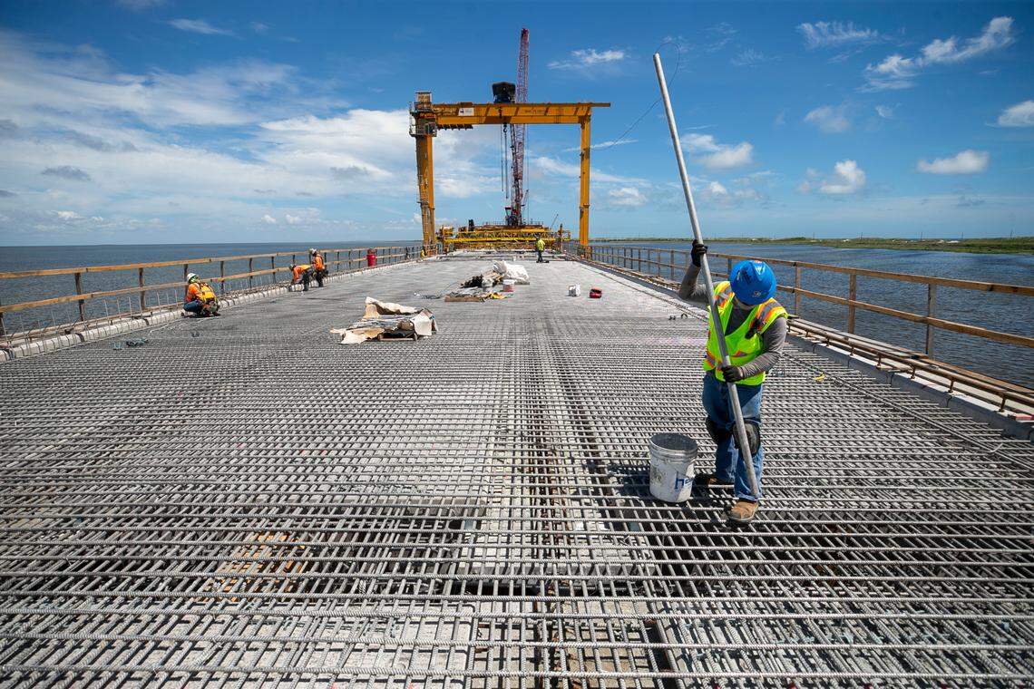 A construction worker on the Jug Handle Bridge on Wednesday, June 30, 2021 in Rodanthe, N.C. The bridge is being build over the Pamlico Sound away from the beach front near an area called the ‘S Curves’, one of the hot spots along NC 12 that is often subjected to erosion and flooding during storms. The new bridge is scheduled to open in early 2022.
