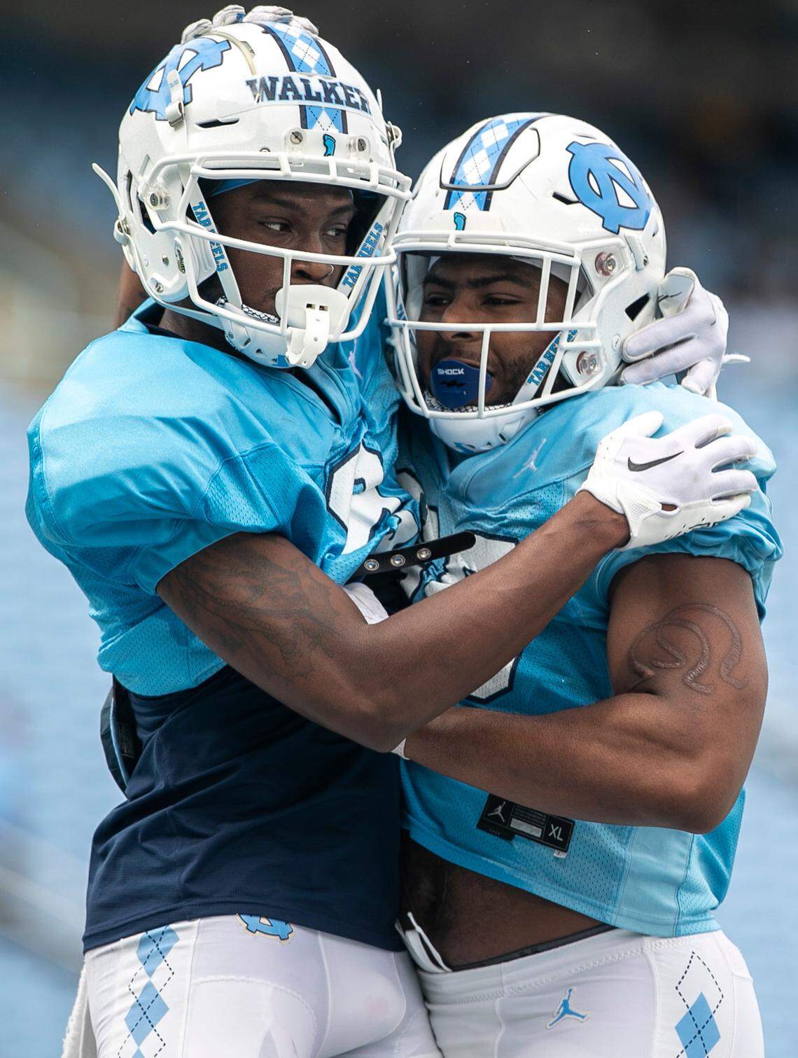 North Carolina wide receiver Devontez Walker (9) embraces tight end Kamari Morales (88) after a touchdown during a scrimmage at the Tar Heels’ open practice on Saturday, March 25, 2023 at Kenan Stadium in Chapel Hill. N.C