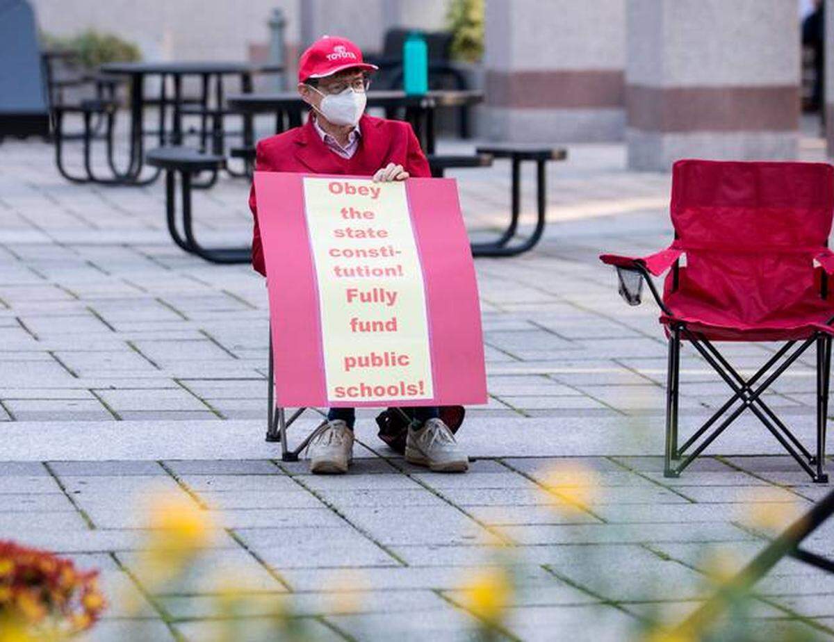 Patricia Long awaits the start of a 2021 prayer vigil in Raleigh urging the N.C. General Assembly to fund the Leandro Plan, which the state Supreme Court has ordered the state to do.