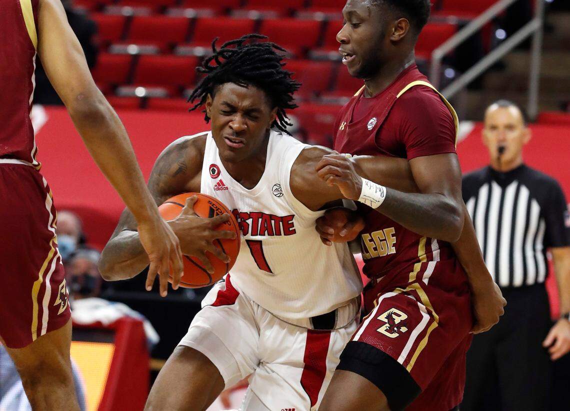 N.C. State’s Dereon Seabron (1) gets around Boston College’s Jay Heath (5) during the second half of N.C. State’s 79-76 victory over Boston College at PNC Arena in Raleigh, N.C., Wednesday, December 30, 2020.